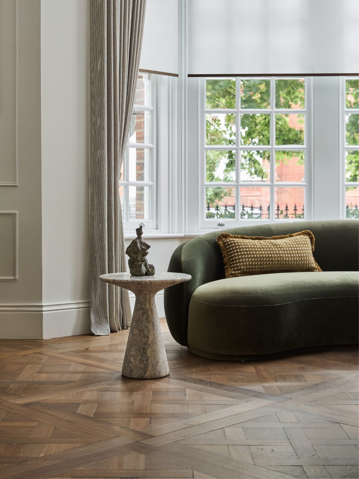 Versailles panel parquet Landmark Tredegar with green sofa