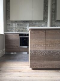Oak tate bute on floor and kitchen fronts with marble tileswidth=
