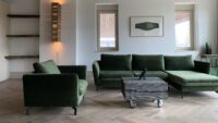 Tate bute herringbone floor with green sofa 3awidth=